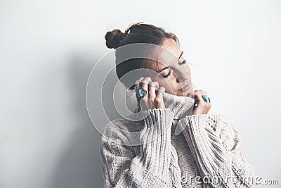 Boho jewelry and woolen sweater on model Stock Photo