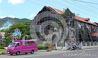 Bohol island,Philippines. Jeepney parking and old ruined church Editorial Stock Photo