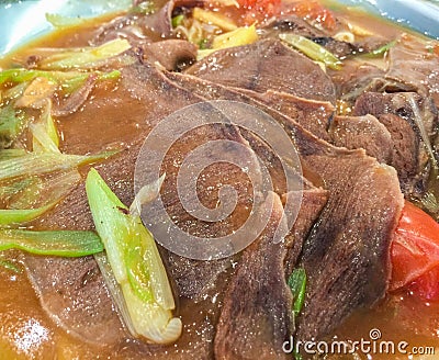 Boiled beef tongue with vegetables Stock Photo