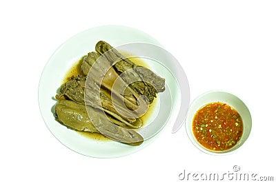 Boiled duck beak with black soy soup on plate dipping spicy sauce Stock Photo