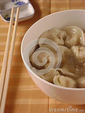 Boiled dumplings with meat filling in soup Stock Photo