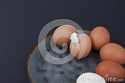 Boiled eggs on a plate. Black background. Place for text. Protein and nutrition Stock Photo