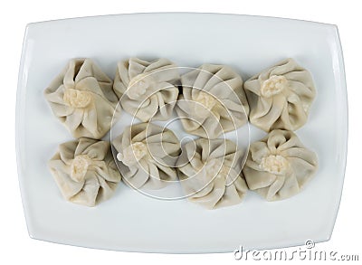 Boiled khinkalis Georgian dumpling on a white plate Stock Photo