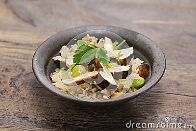 Boiled rice with matsutake mushrooms, Japanese autumn food Stock Photo