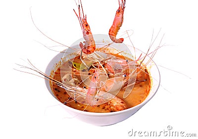 Boiled shrimp falling in Thai spicy soup or tom yum kung on bowl Stock Photo