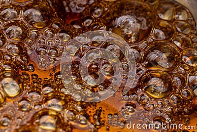 Boiling sugar with bubbles turns into caramel, caramelization Stock Photo