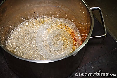 Boiling sugar caramel Stock Photo
