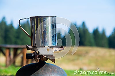 Boiling steaming water in the mountain for tea and coffee Stock Photo