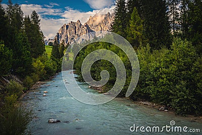 Boite river and high mountains at sunset, Dolomites, Italy Stock Photo