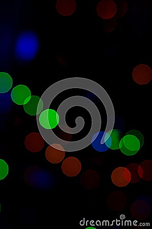 Bokeh of colored round festive Christmas lights Stock Photo