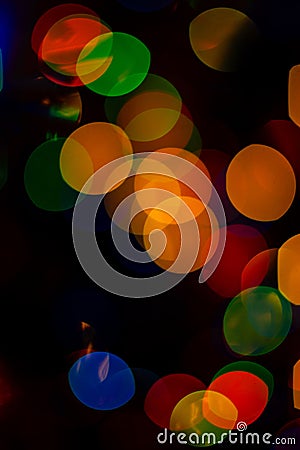 Bokeh of colored round festive Christmas lights Stock Photo