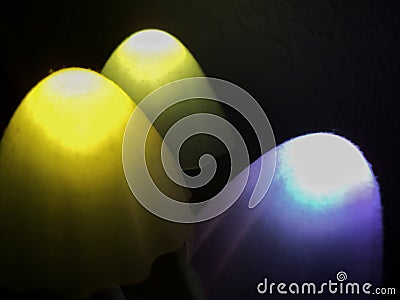 Bokeh lights abstract background in dark night colors. Photo. Large multi-colored round glare from headlights or lamps of red, Stock Photo