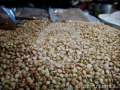 Bokeh shot of small seeds used for Hindu rituals is being sold in a grocery store in India Stock Photo