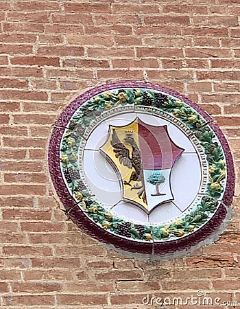 Bolgheri, Livorno, Italy. The Bolgheri Castle with tower, stemma, coat of arms of the Gherardesca. Editorial Stock Photo