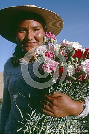 Bolivian girl holding bunch of carnations Editorial Stock Photo