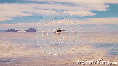 Bolivian salt lake and vehicle, Salar de Uyuni Stock Photo