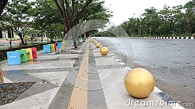 bollard ball barrier between road and sidewalk part of street furniture Stock Photo