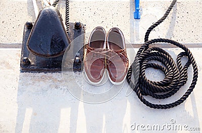 Bollard with nautic shoes and rope coil Stock Photo