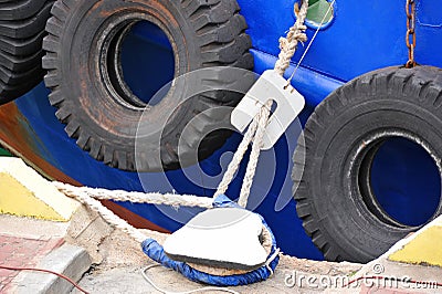 Bollard and tyre fender Stock Photo
