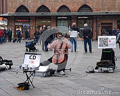 Busker playing cello in Bologna. Busking on street Editorial Stock Photo