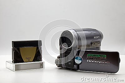 Sony Handycam DCR-HC90E with Mini DV cassette. Vintage Technology isolated on white Editorial Stock Photo