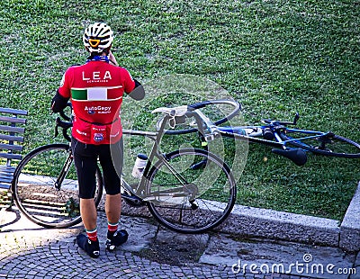 Cyclist resting in the park of the Sanctuary of San Luca. Bologna, Italy Editorial Stock Photo