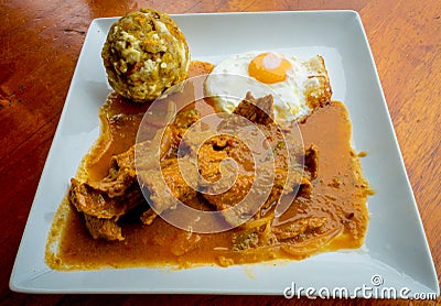 Bolon de verde with fried eggs and meat stew ecuadorian food galapagos Stock Photo