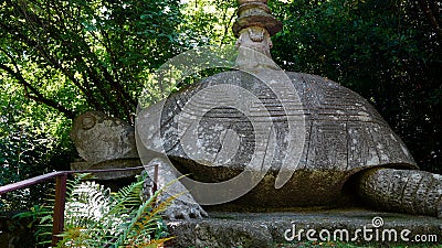 Sculpture of giant turtle in the Park of the Monsters of Bomarzo, a natural park adorned with numerous basalt sculptures dating ba Editorial Stock Photo