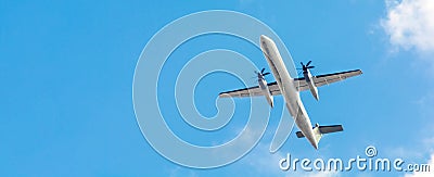 Bombardier Dash Turboprop aircraft in clear blue sky. Passenger Transportation. Aviation. Air business. Free space for text Stock Photo