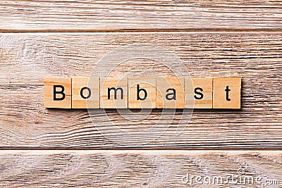 Bombast word written on wood block. bombast text on wooden table for your desing, concept Stock Photo