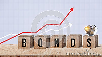 Bonds word in wooden blocks with coins stacked in increasing stacks. Bonds increasing concept, investment bond concept Raising Stock Photo