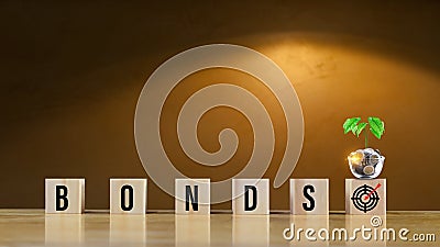Bonds word in wooden blocks with coins stacked in increasing stacks. Bonds increasing concept, investment bond concept Raising Stock Photo