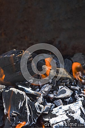 Bonfire embers. BBQ coals with fire. Close-up of the combustion process of wood, charcoal for barbecue Stock Photo