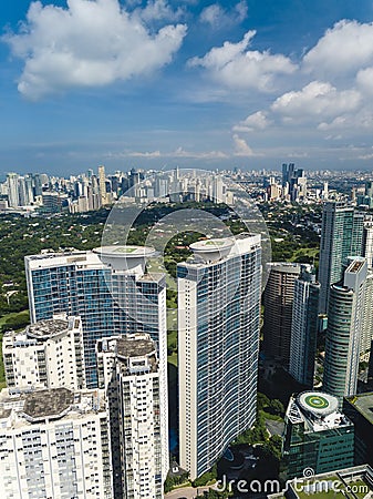 Bonifacio Global City, Taguig, Metro Manila - Fort Bonifacio skyline, with Makati cityscape at the upper left of photo Editorial Stock Photo