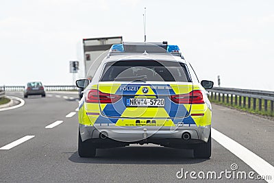 Bonn, Germany May 23, 2019. German police car BMW driving on the highway, rear view. Editorial Stock Photo