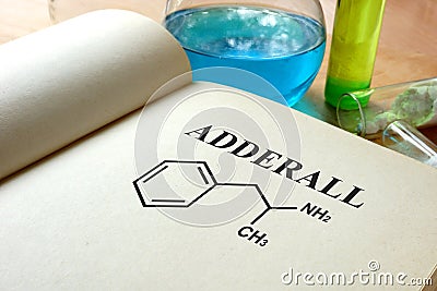 Book with adderall and test tubes. Stock Photo