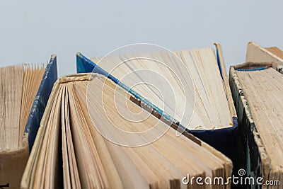 Book background. Old books in the library. Bookshelf shop. Knowledge publications, literature. Bookish bookstore, bookshop. Stock Photo