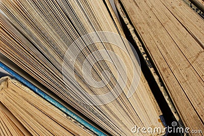 Book background. Old books in the library. Bookshelf shop. Knowledge publications, literature. Bookish bookstore, bookshop. Stock Photo