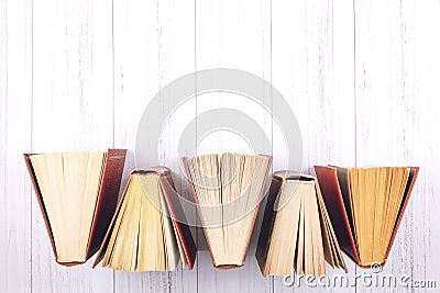 Book background. Top view of open hardback books on wooden table. Education, literature, knowledge, Back to school. Copy space Stock Photo