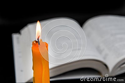 Book with candles Stock Photo