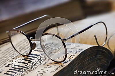 Book and eyeglasses Stock Photo