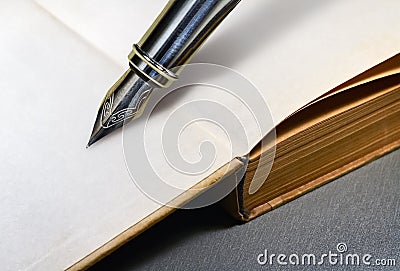 Book and fountain pen Stock Photo