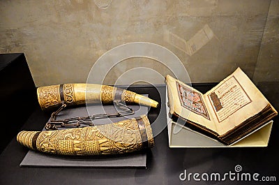 Book with illuminations and ivory horns Editorial Stock Photo