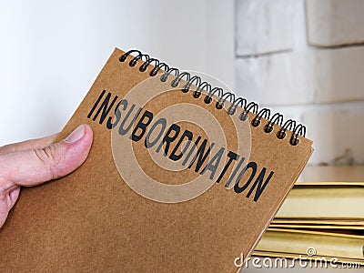 Book with info about insubordination on the workplace. Stock Photo