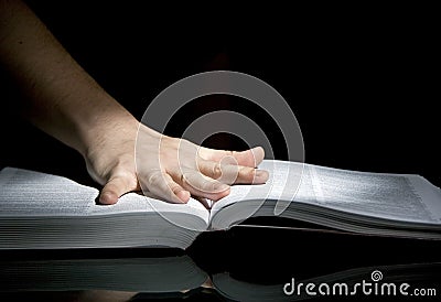 Book and open hand Stock Photo