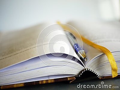 Book and pen Stock Photo