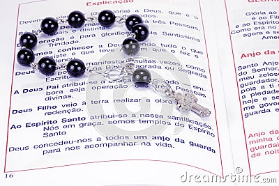 A book and rosary beads Stock Photo