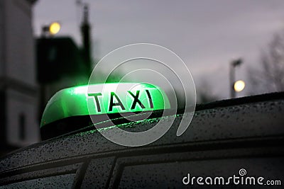 Paris Lighting taxi sign on the roof in rainy day Stock Photo