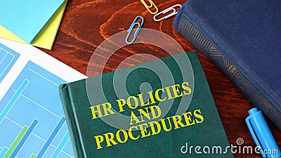 Book with title HR policies and procedures. Stock Photo