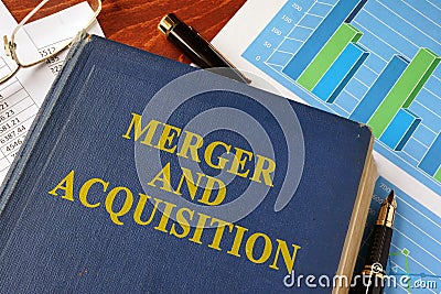 Book with title Merger and Acquisition. Stock Photo